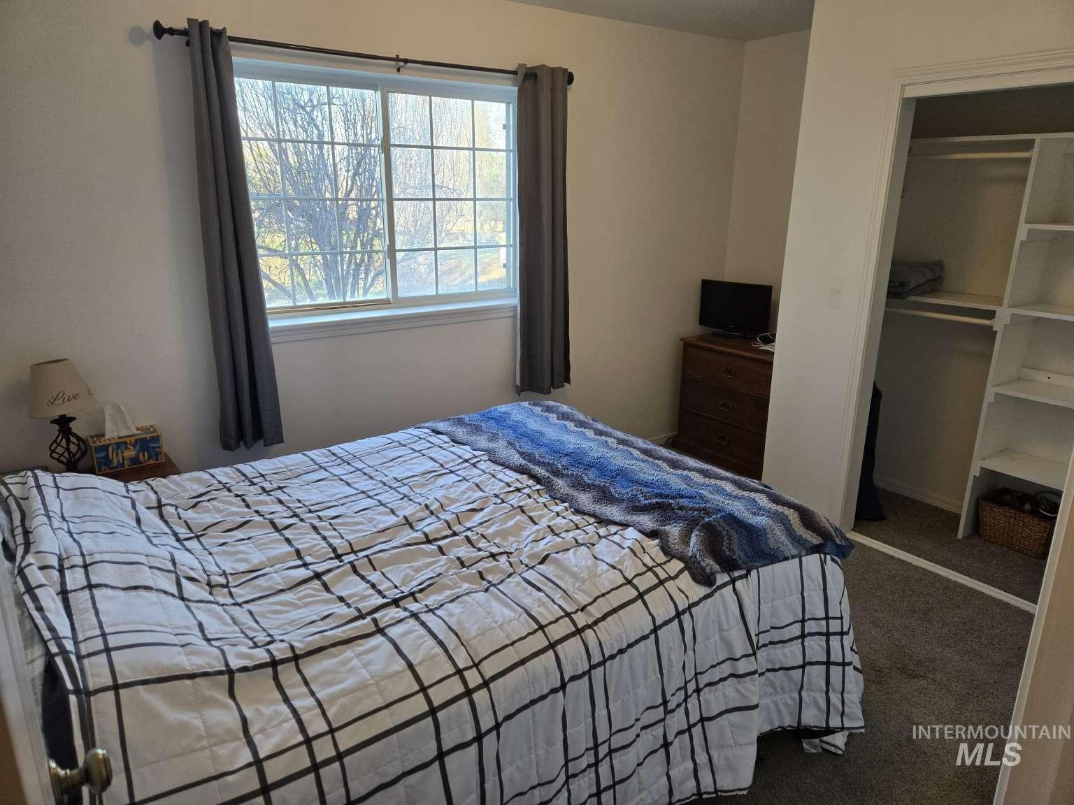 1065 Loafer Lane Weiser, ID 83672 - Photo 16 of 36 Bedroom with carpet floors and a closet