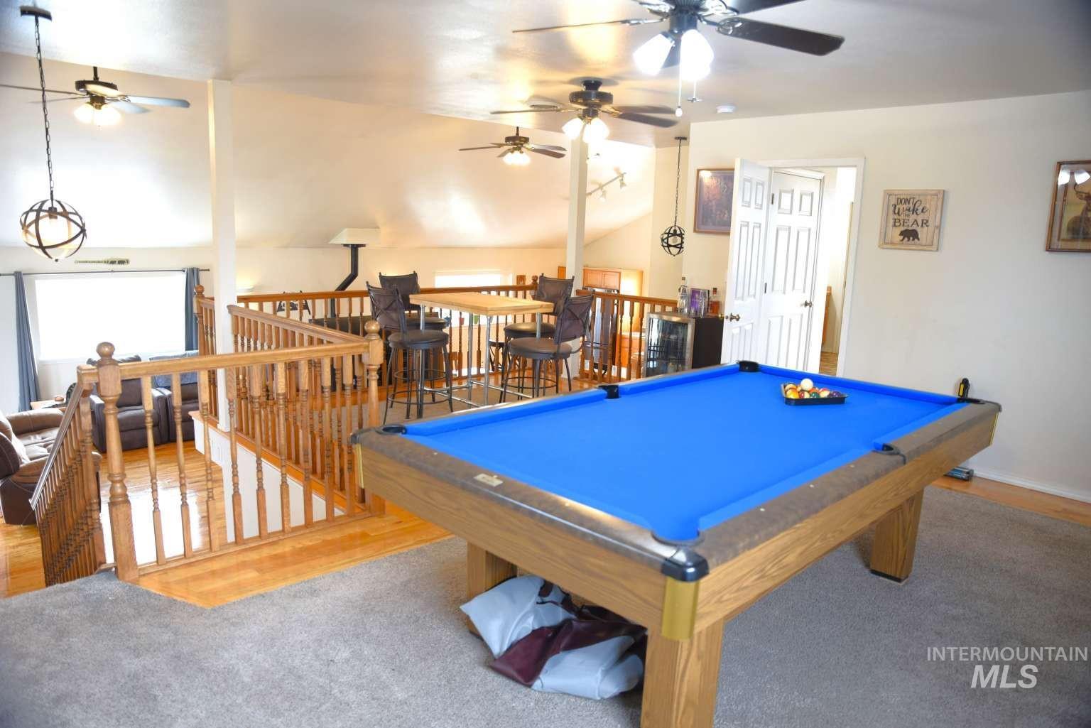 1065 Loafer Lane Weiser, ID 83672 - Photo 29 of 36 Rec room with pool table, vaulted ceiling, and a ceiling fan