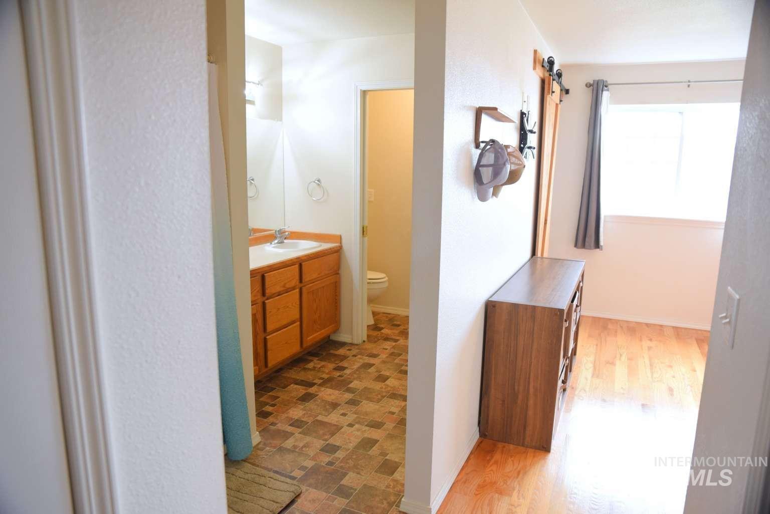 1065 Loafer Lane Weiser, ID 83672 - Photo 30 of 36 Bathroom featuring toilet and vanity