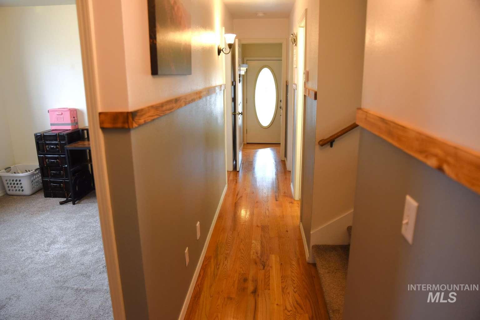 1065 Loafer Lane Weiser, ID 83672 - Photo 8 of 36 Hall with light wood finished floors and baseboards