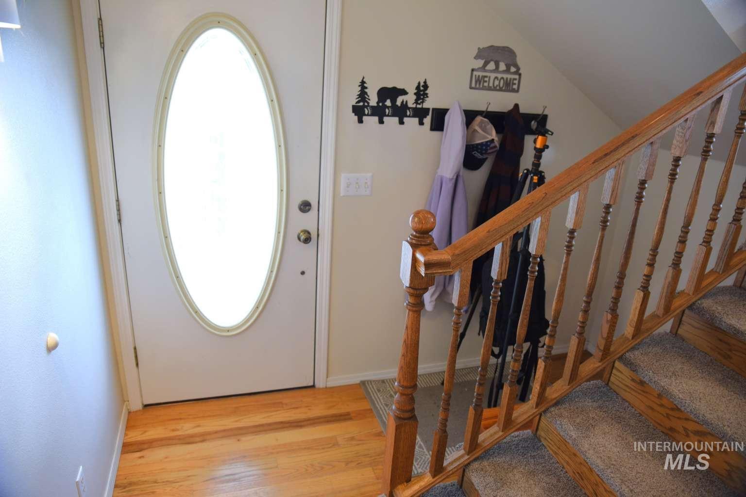 1065 Loafer Lane Weiser, ID 83672 - Photo 9 of 36 Foyer featuring light wood-type flooring and lofted ceiling