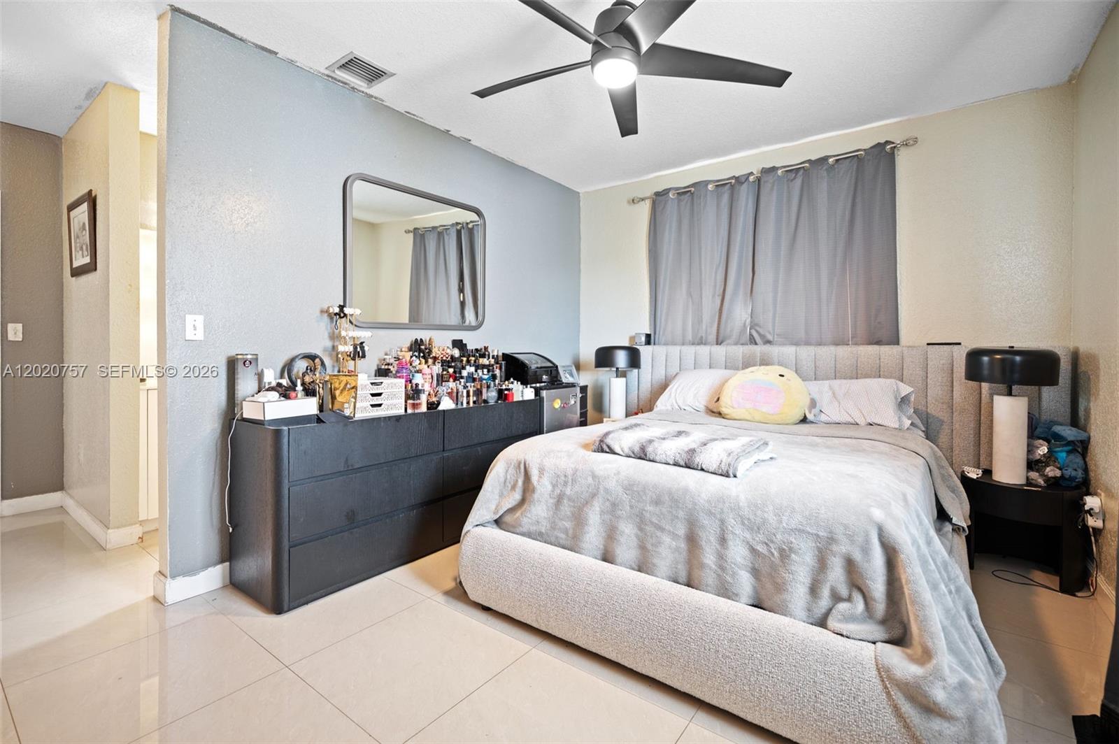 255 East 3rd Street, Unit 1 Hialeah, FL 33010 - Photo 16 of 38 a bedroom with a bed and a window
