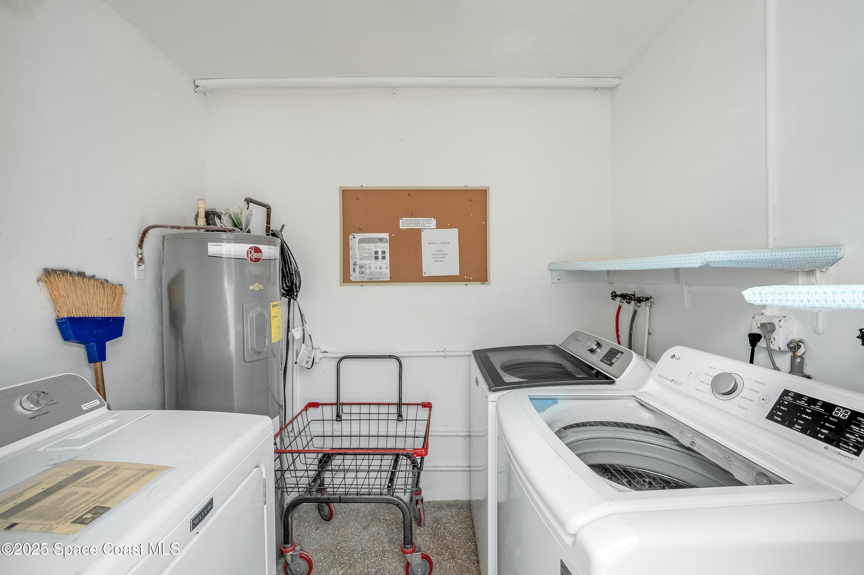 1700 Atlantic Street, Unit 9 Melbourne Beach, FL 32951 - Photo 19 of 30 a bedroom with a bed and a table in it