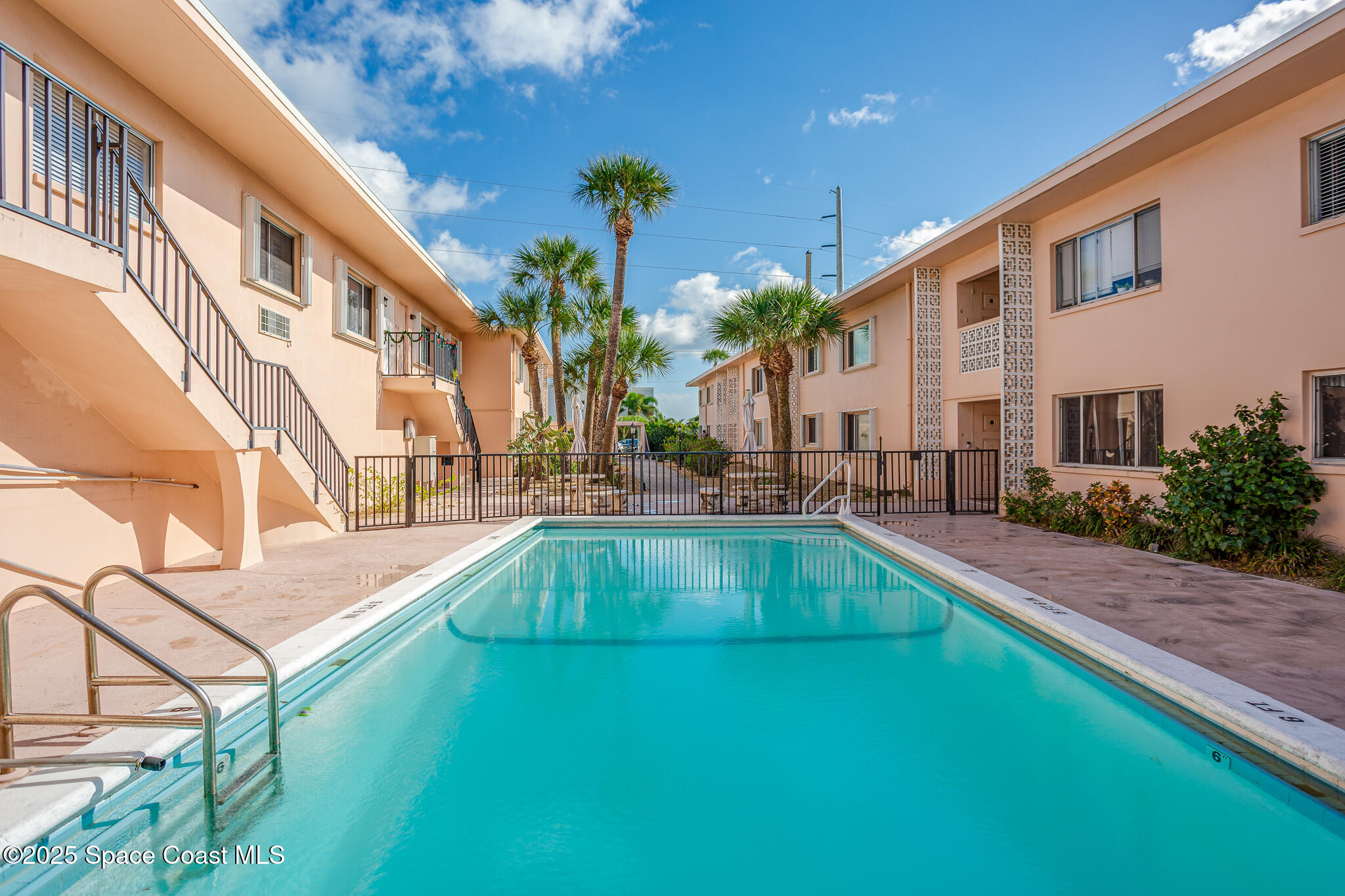 1700 Atlantic Street, Unit 9 Melbourne Beach, FL 32951 - Photo 2 of 30 a view of an house with swimming pool