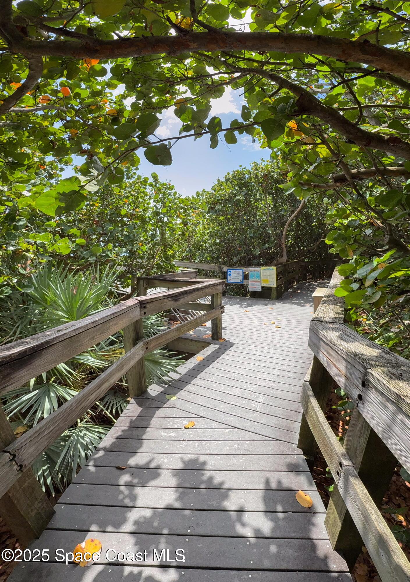 1700 Atlantic Street, Unit 9 Melbourne Beach, FL 32951 - Photo 22 of 30 a view of a balcony with floor to ceiling windows