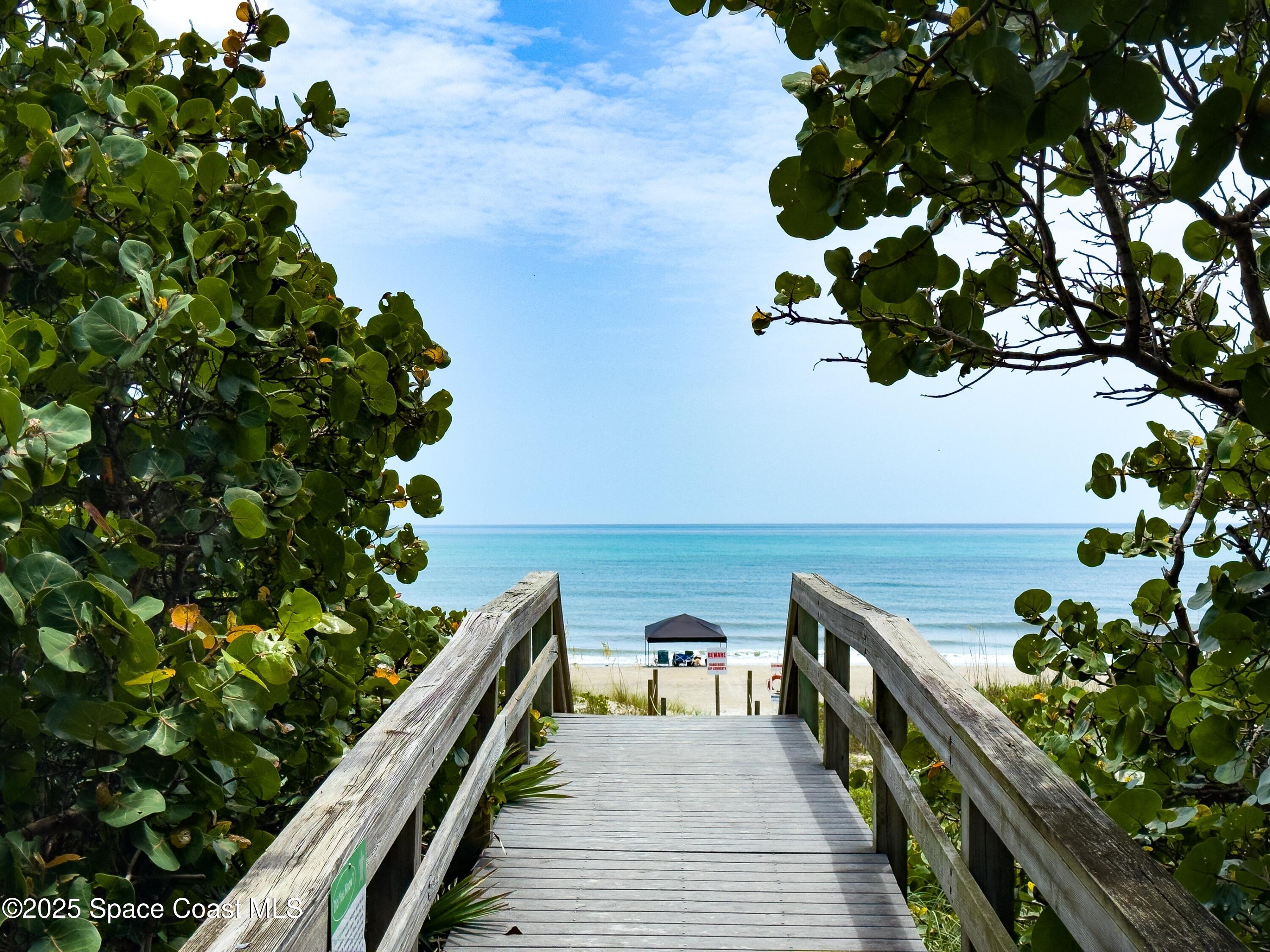 1700 Atlantic Street, Unit 9 Melbourne Beach, FL 32951 - Photo 25 of 30 a view of balcony with wooden floor
