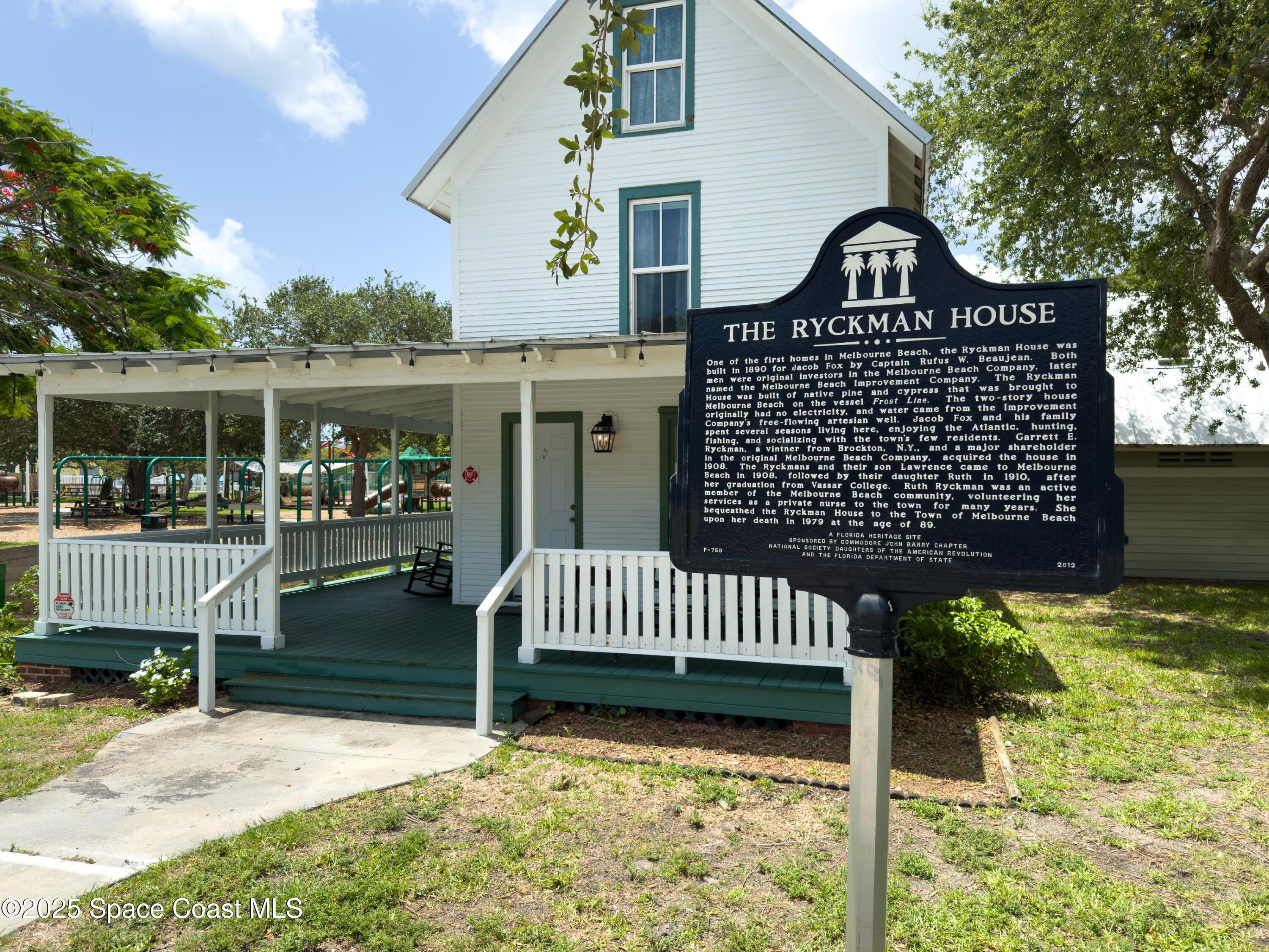 1700 Atlantic Street, Unit 9 Melbourne Beach, FL 32951 - Photo 29 of 30 a front view of a house with a yard