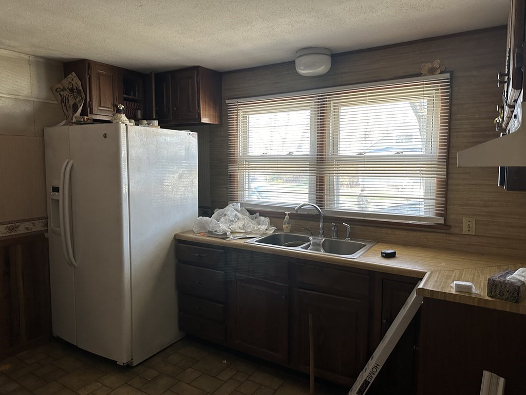 212 Almira Road Springfield, MA 01119 - Photo 2 of 3 a kitchen with stainless steel appliances granite countertop a refrigerator and a sink