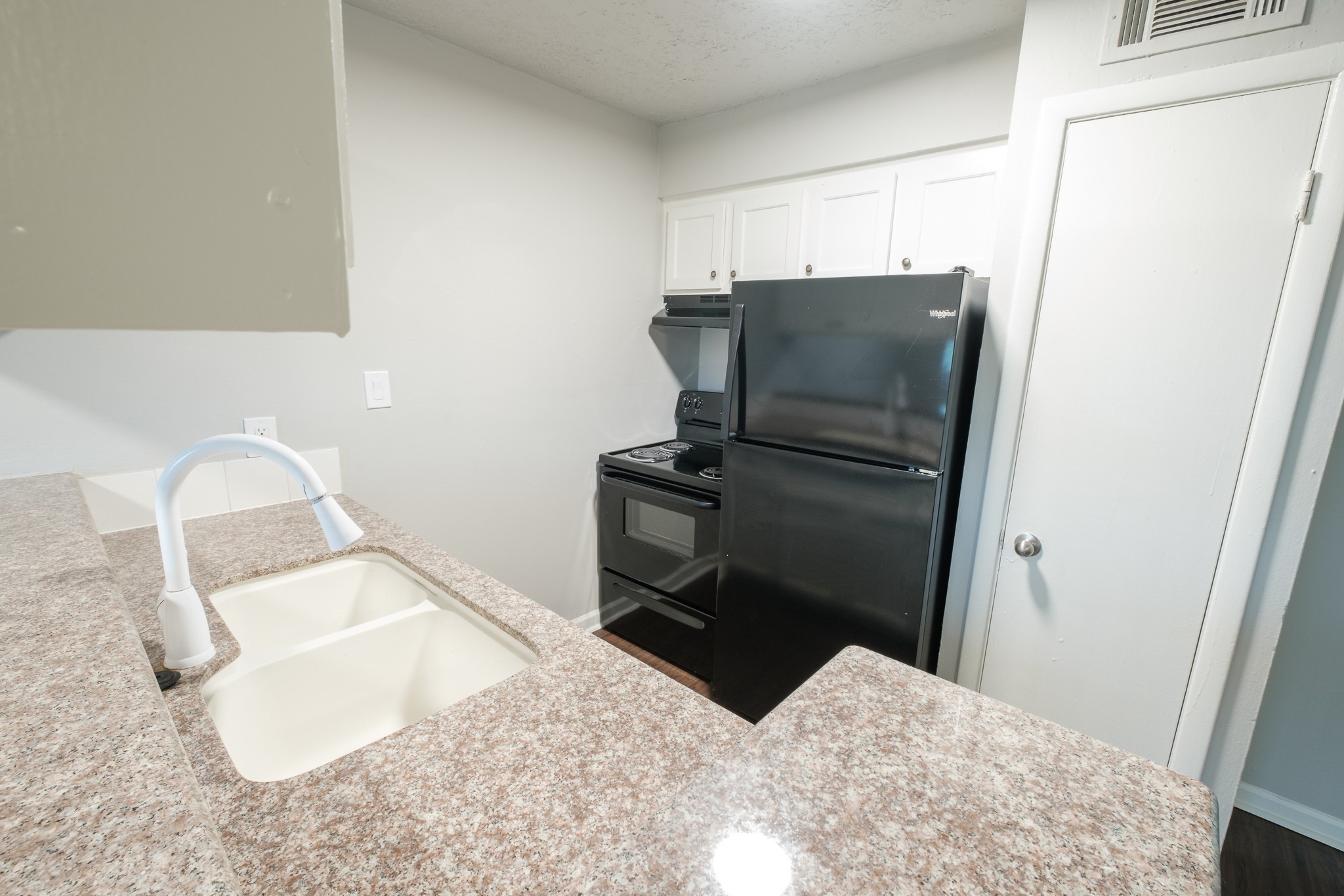 6519 Sloan Street, Unit 4 Houston, TX 77087 - Photo 2 of 11 a kitchen with a refrigerator and a sink