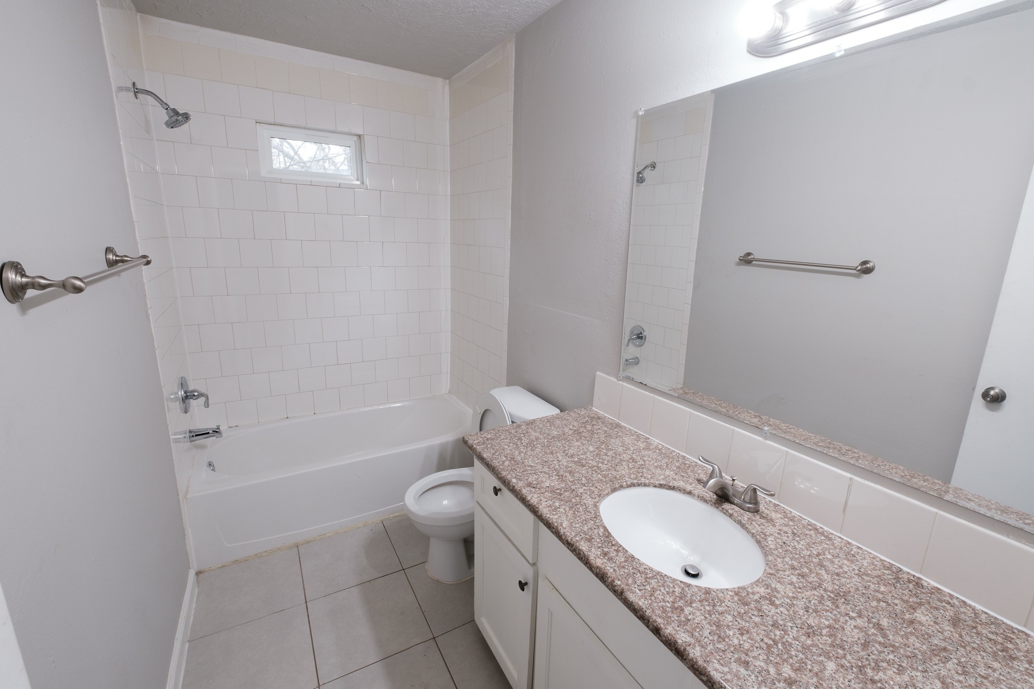 6519 Sloan Street, Unit 4 Houston, TX 77087 - Photo 4 of 11 a bathroom with a granite countertop sink toilet and shower