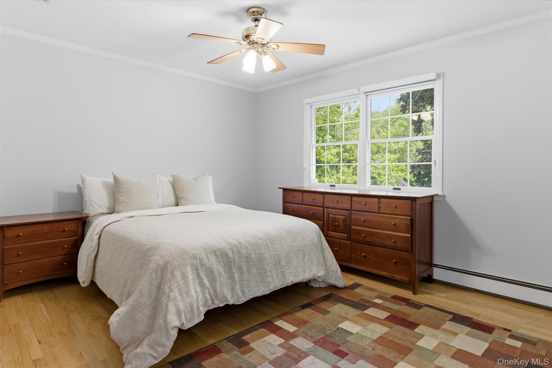 6 Brandy Road Cold Spring Harbor, NY 11724 - Photo 18 of 25 a bedroom with a bed and a window