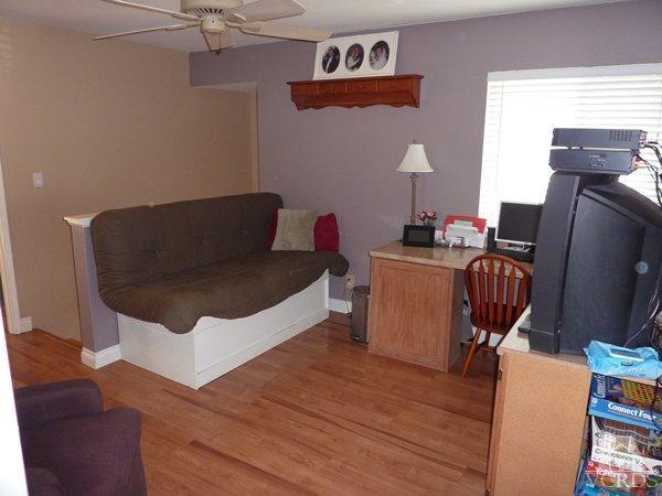 2430 Invar Court Simi Valley, CA 93065 - Photo 20 of 26 a living room with furniture a flat screen tv and dresser