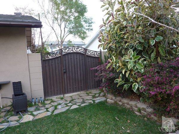 2430 Invar Court Simi Valley, CA 93065 - Photo 3 of 26 a backyard of a house with lots of green space