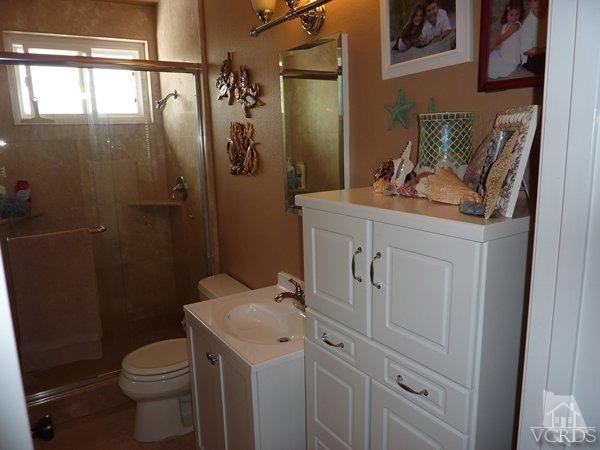 2430 Invar Court Simi Valley, CA 93065 - Photo 22 of 26 a bathroom with a granite countertop sink toilet and shower