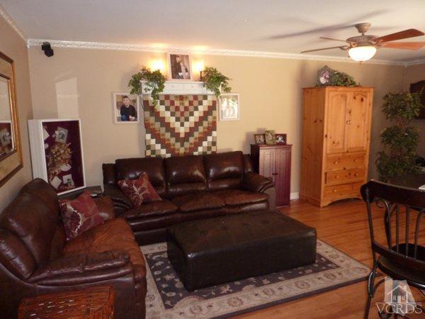 2430 Invar Court Simi Valley, CA 93065 - Photo 9 of 26 a living room with furniture and a fireplace