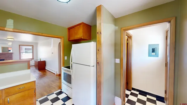 a kitchen with stainless steel appliances a refrigerator and a stove
