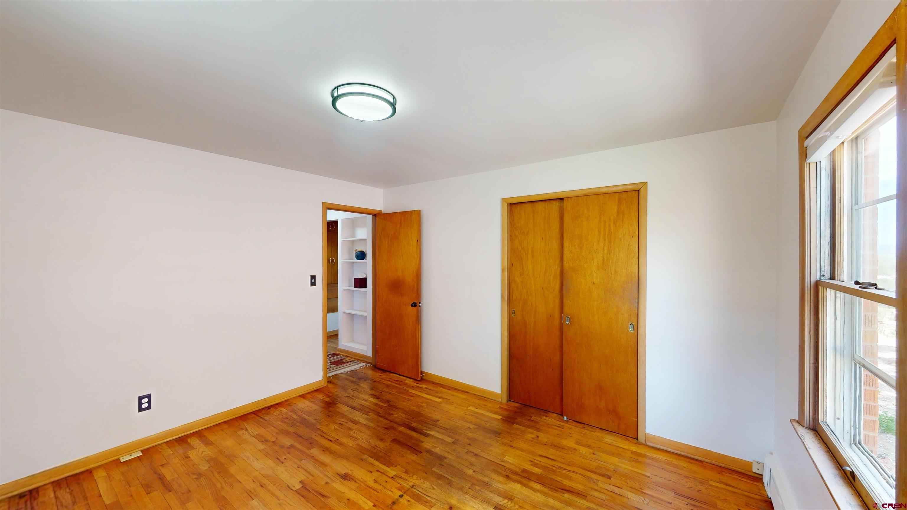 320 Grand Boulevard Delta, CO 81416 - Photo 13 of 38 a view of room with window and a ceiling fan