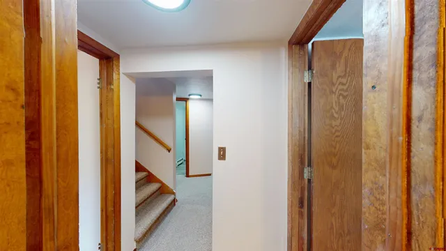 a view of a bathroom from a hallway