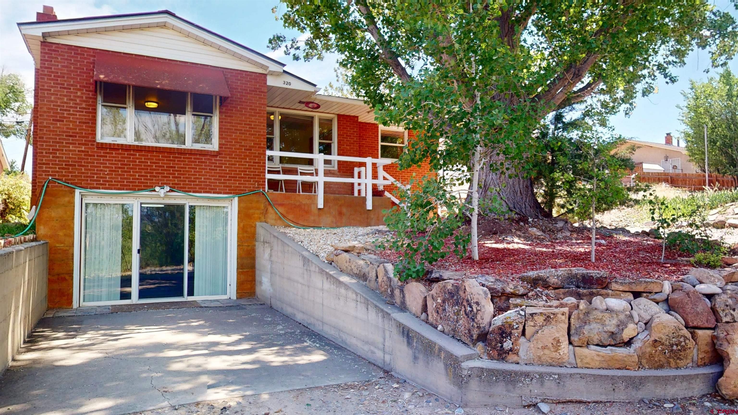 320 Grand Boulevard Delta, CO 81416 - Photo 2 of 38 a view of a house with backyard and sitting area