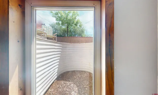 a view of a glass door with a balcony