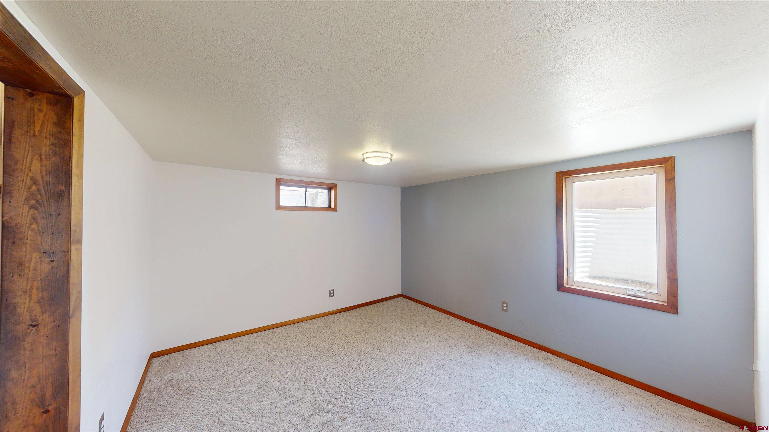 320 Grand Boulevard Delta, CO 81416 - Photo 22 of 38 an empty room with windows