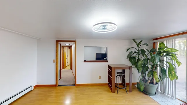 a view of livingroom with furniture and a potted plant