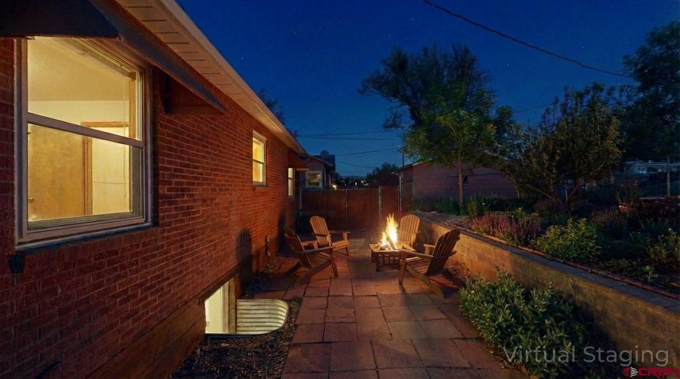 320 Grand Boulevard Delta, CO 81416 - Photo 33 of 38 a view of backyard with plants and outdoor seating