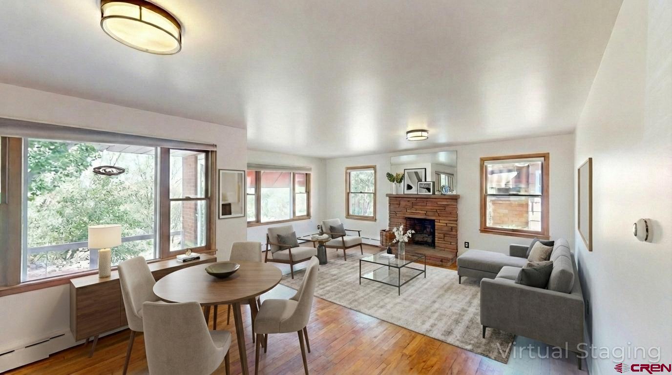 320 Grand Boulevard Delta, CO 81416 - Photo 6 of 38 a living room with fireplace furniture and a large window