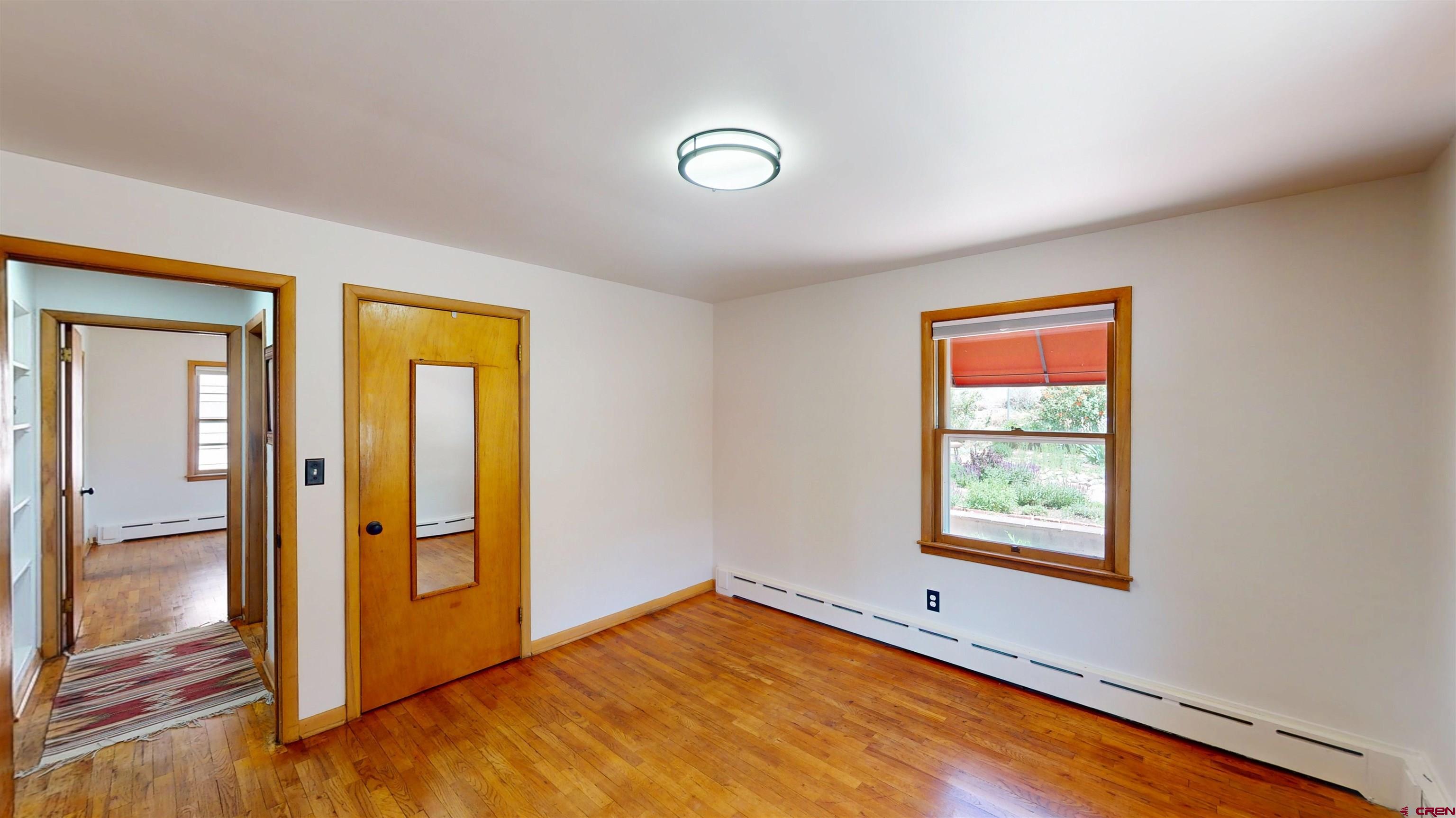 320 Grand Boulevard Delta, CO 81416 - Photo 9 of 38 wooden floor in an empty room with a window