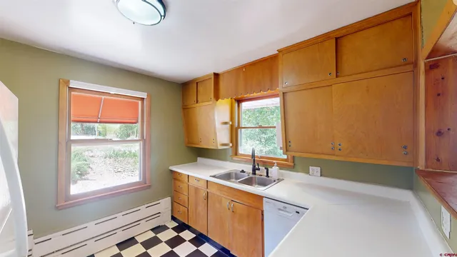 a room with a window and a sink