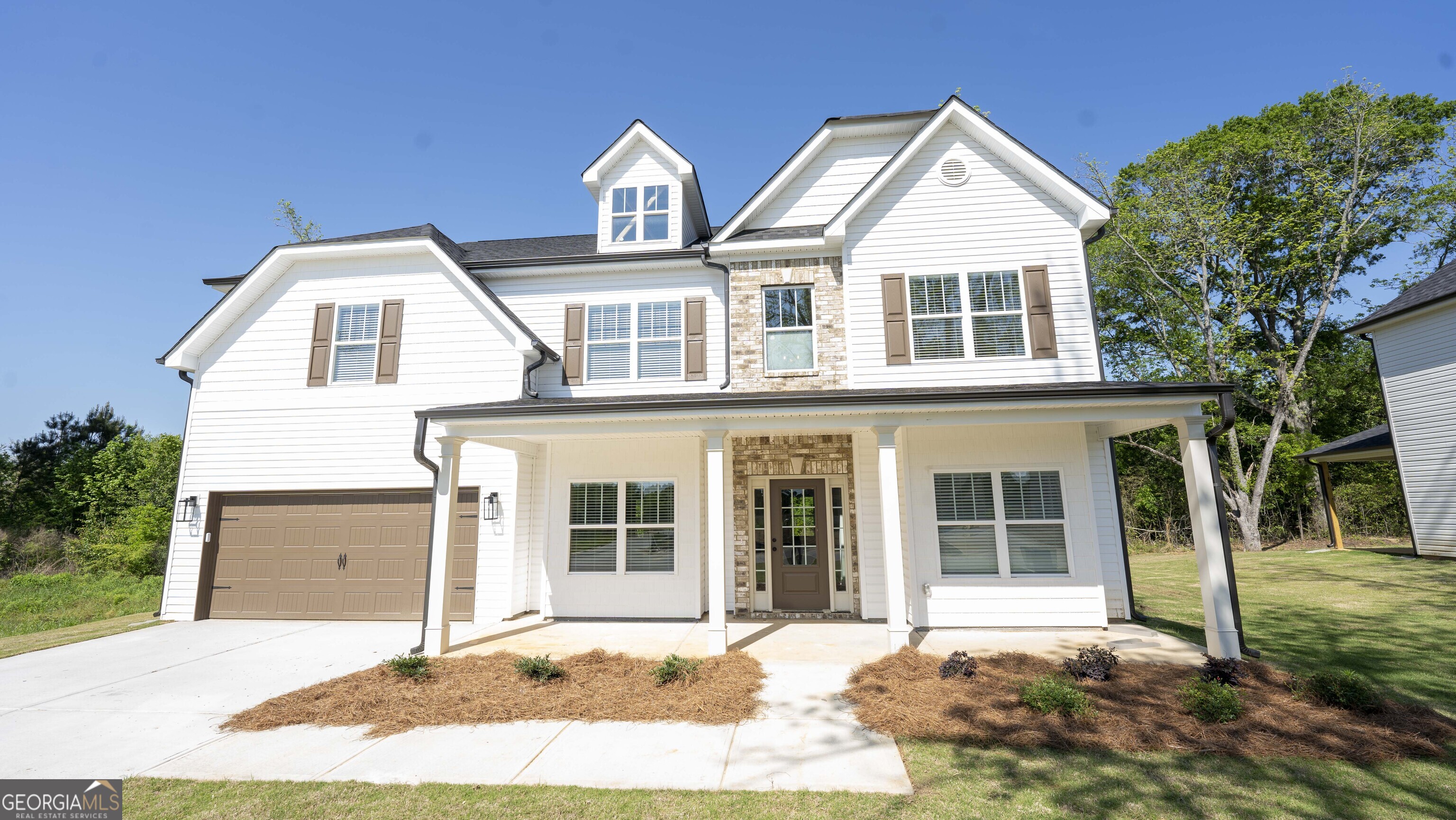 124 Bluecoat Trail Byron, GA 31008 - Photo 13 of 86 a front view of a house with a yard