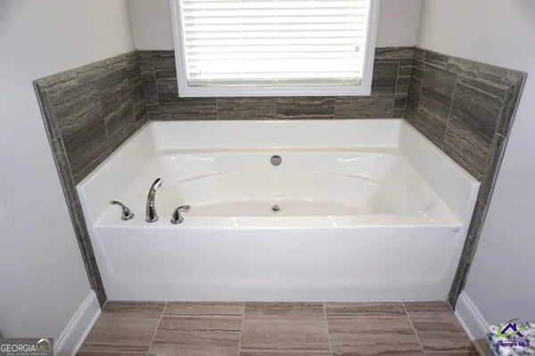 a bathroom with a bathtub