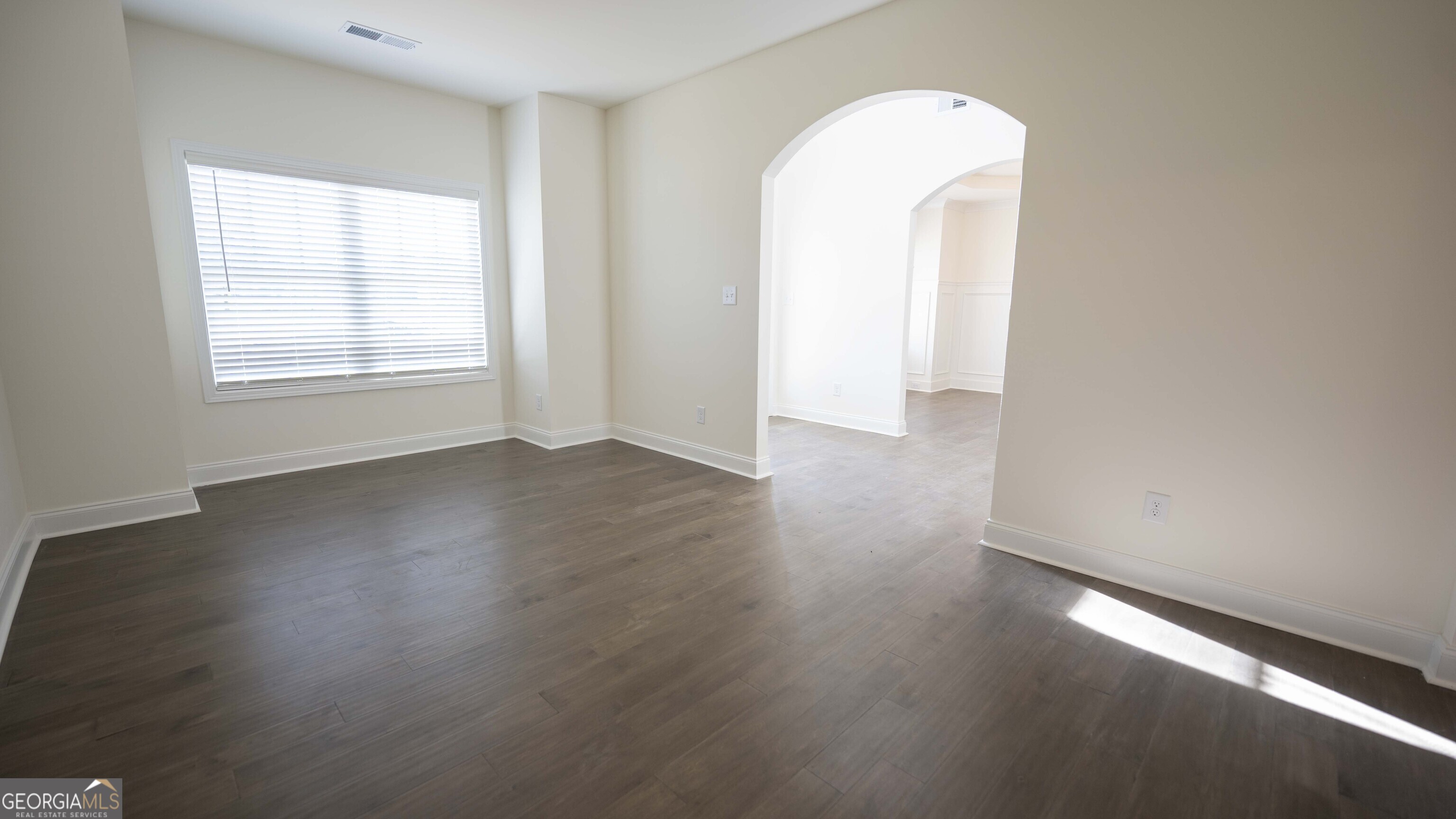 124 Bluecoat Trail Byron, GA 31008 - Photo 21 of 86 an empty room with wooden floor and windows