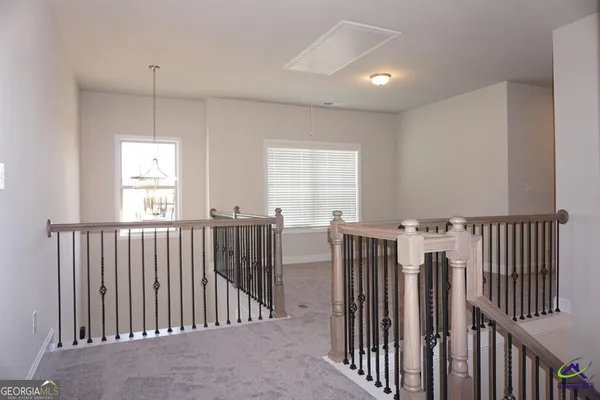 a view of hallway with windows
