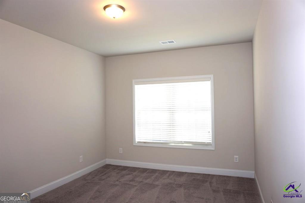 124 Bluecoat Trail Byron, GA 31008 - Photo 24 of 86 an empty room with a window