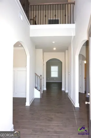 a view of gallery with wooden floor