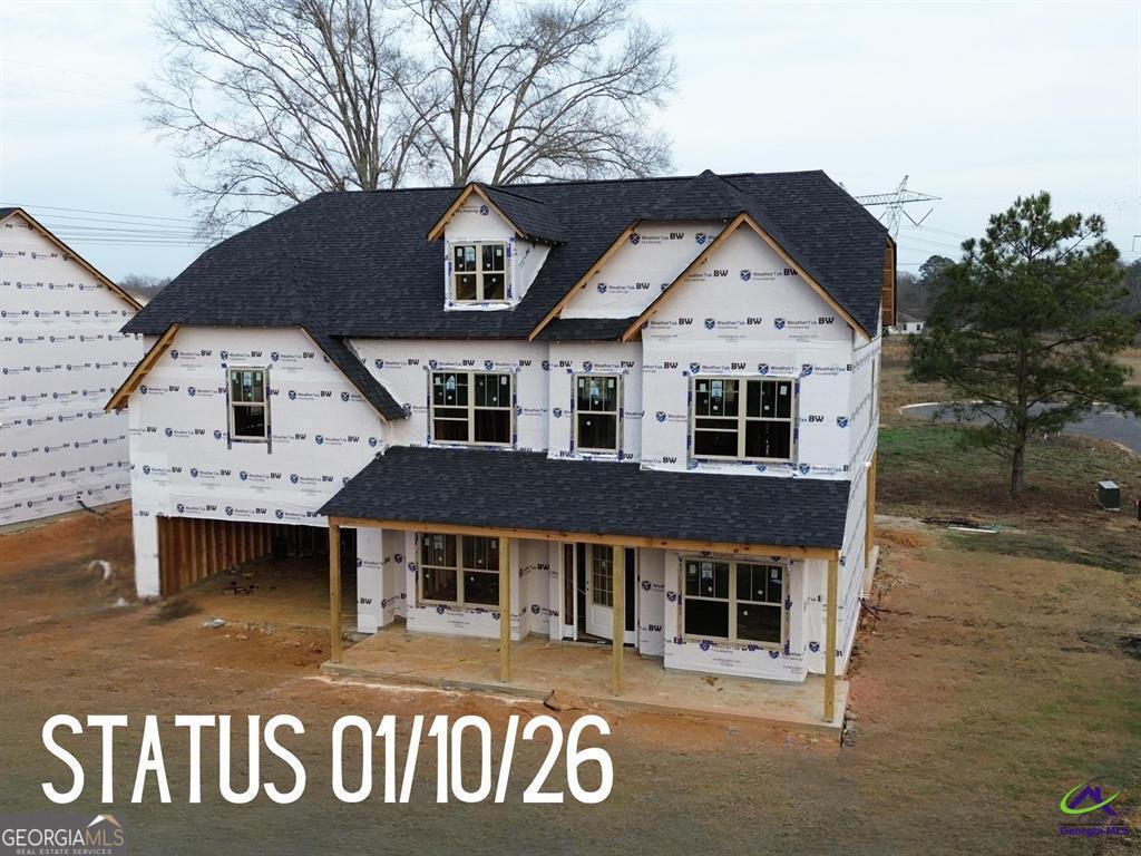 124 Bluecoat Trail Byron, GA 31008 - Photo 4 of 86 a view of a white house with a large window
