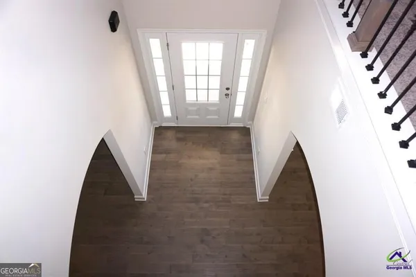 a view of a hallway view with floor to ceiling window