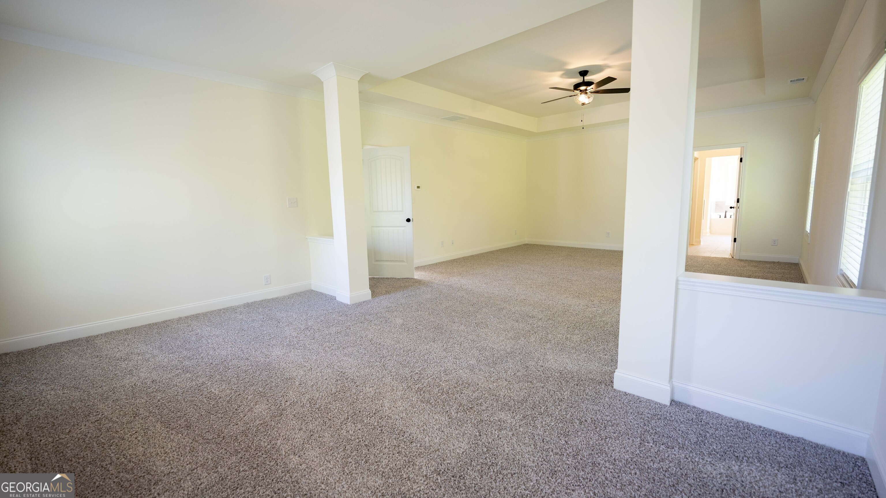 124 Bluecoat Trail Byron, GA 31008 - Photo 47 of 86 a view of a big room with closet and chandelier fan