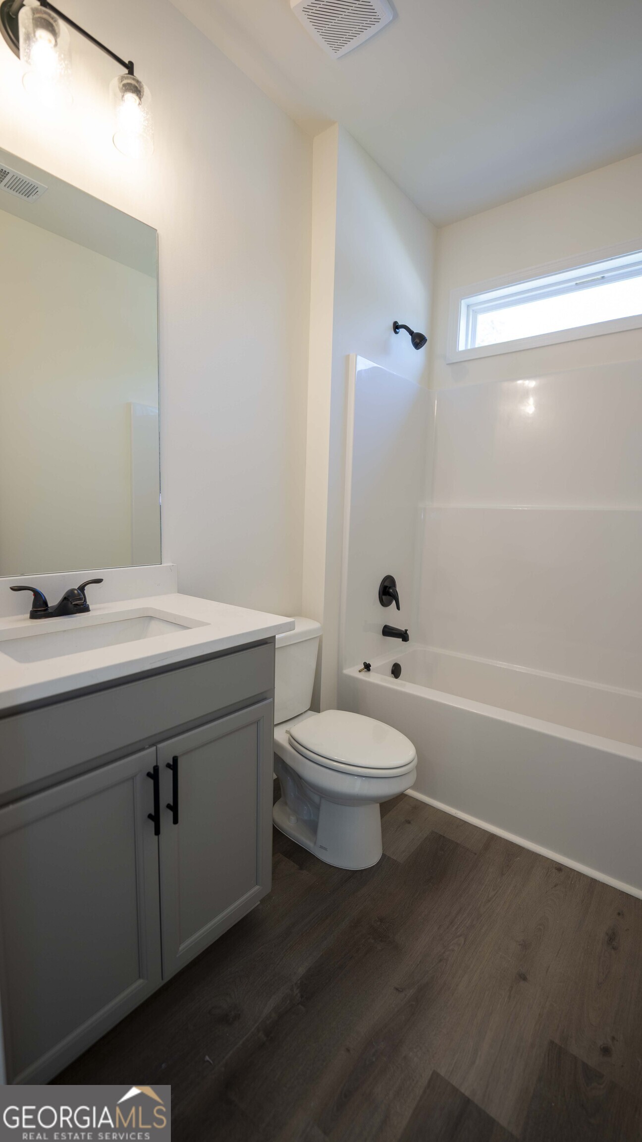 124 Bluecoat Trail Byron, GA 31008 - Photo 61 of 86 a bathroom with a sink a toilet and shower