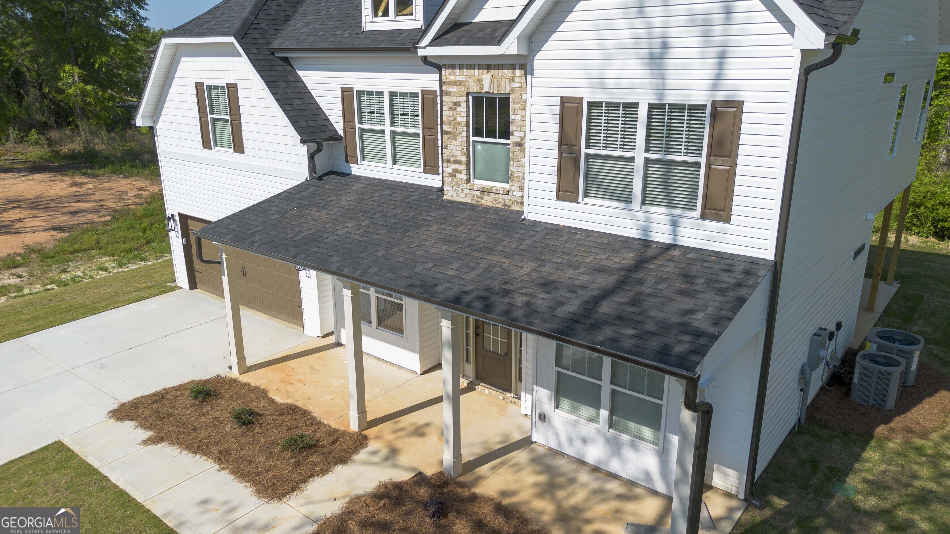 124 Bluecoat Trail Byron, GA 31008 - Photo 7 of 86 a house view with a outdoor space