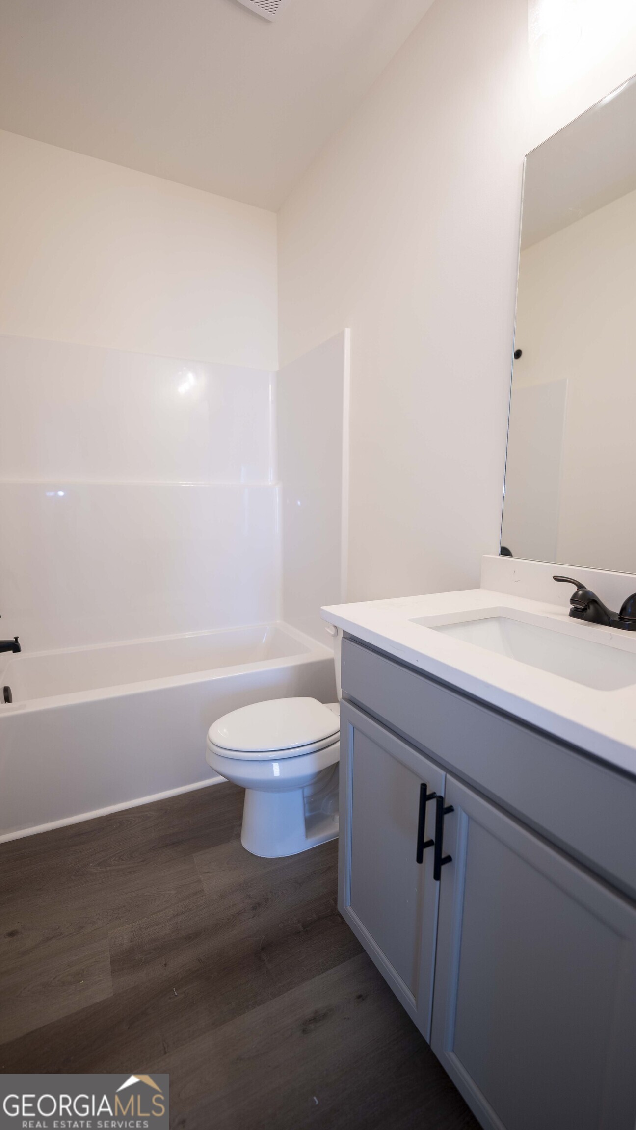 124 Bluecoat Trail Byron, GA 31008 - Photo 75 of 86 a bathroom with a sink a toilet and bathtub