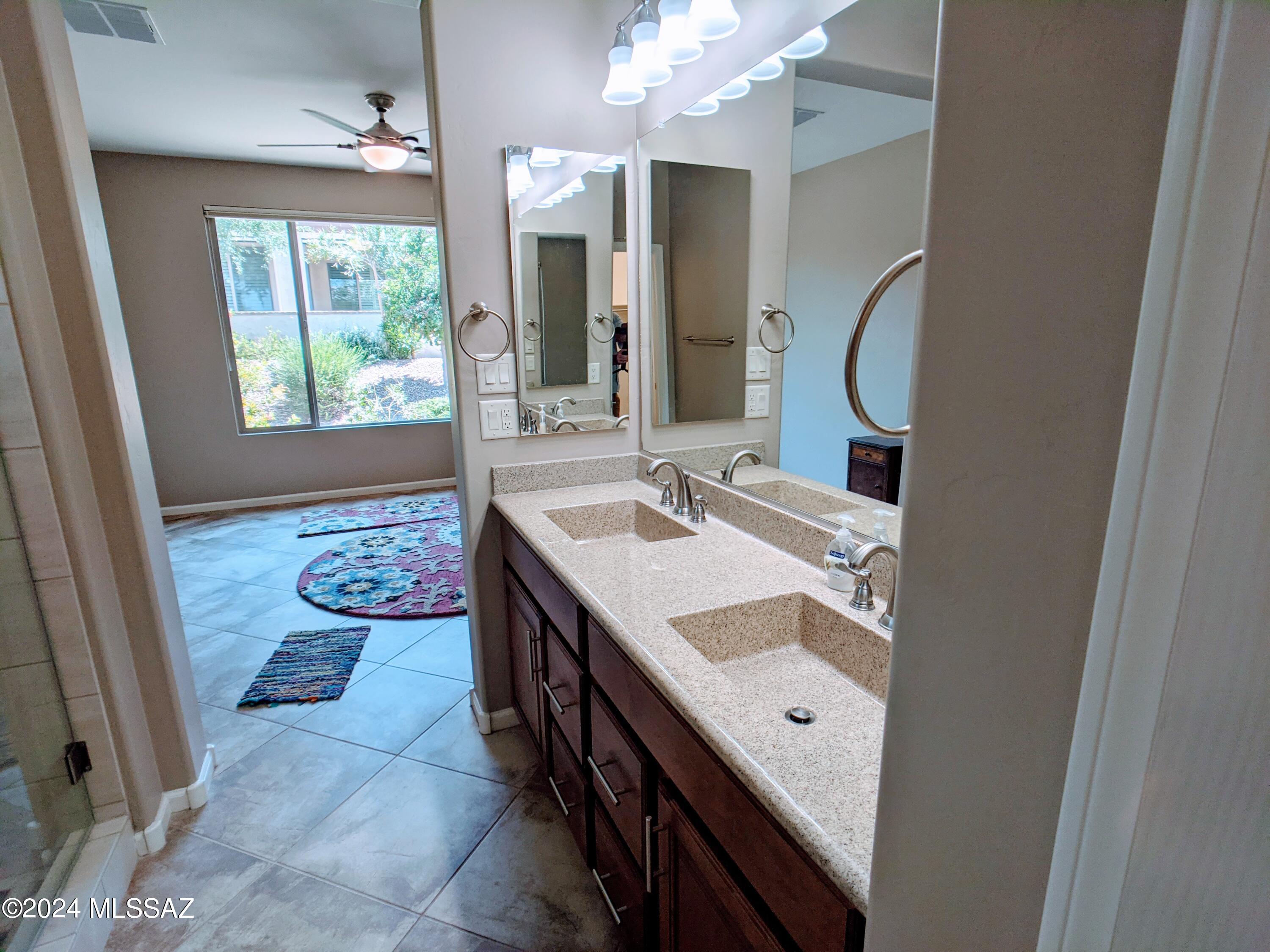 61021 East Slate Road Oracle, AZ 85623 - Photo 13 of 18 a bathroom with a sink and a mirror