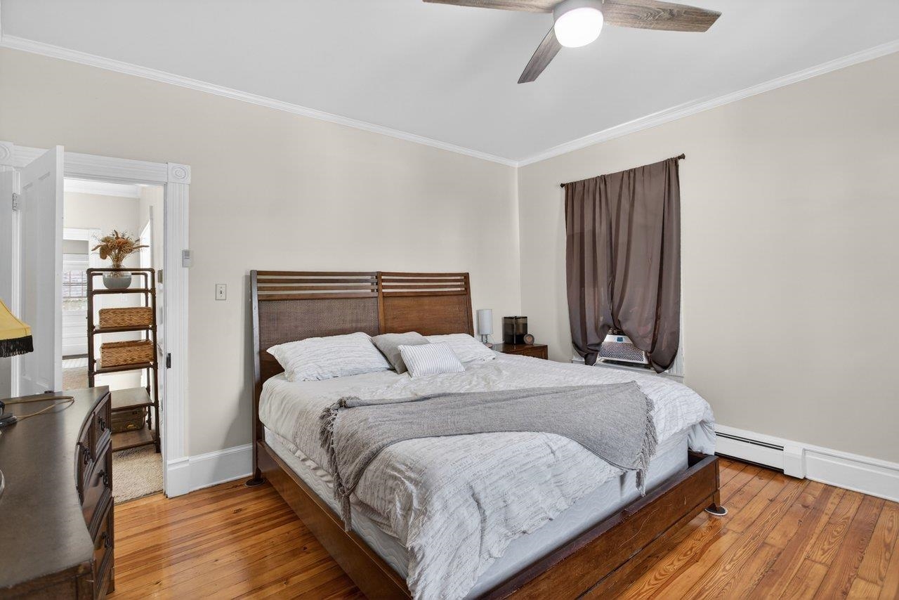 420 West Spring Street Woodstock, VA 22664 - Photo 22 of 67 a bedroom with a bed and wooden floor