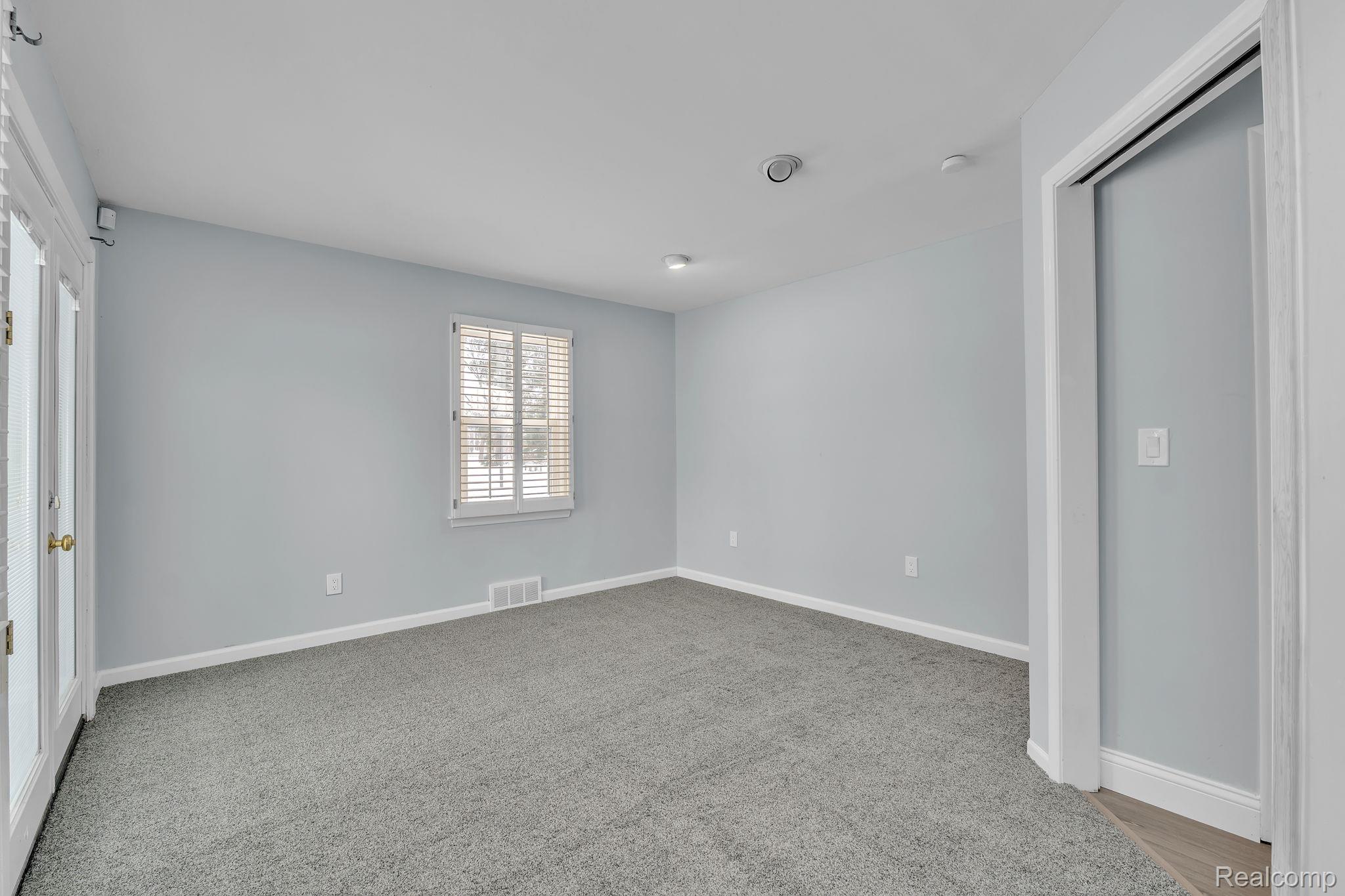 6576 Inkster Road West Bloomfield, MI 48322 - Photo 50 of 62 Unfurnished bedroom featuring light colored carpet and a closet