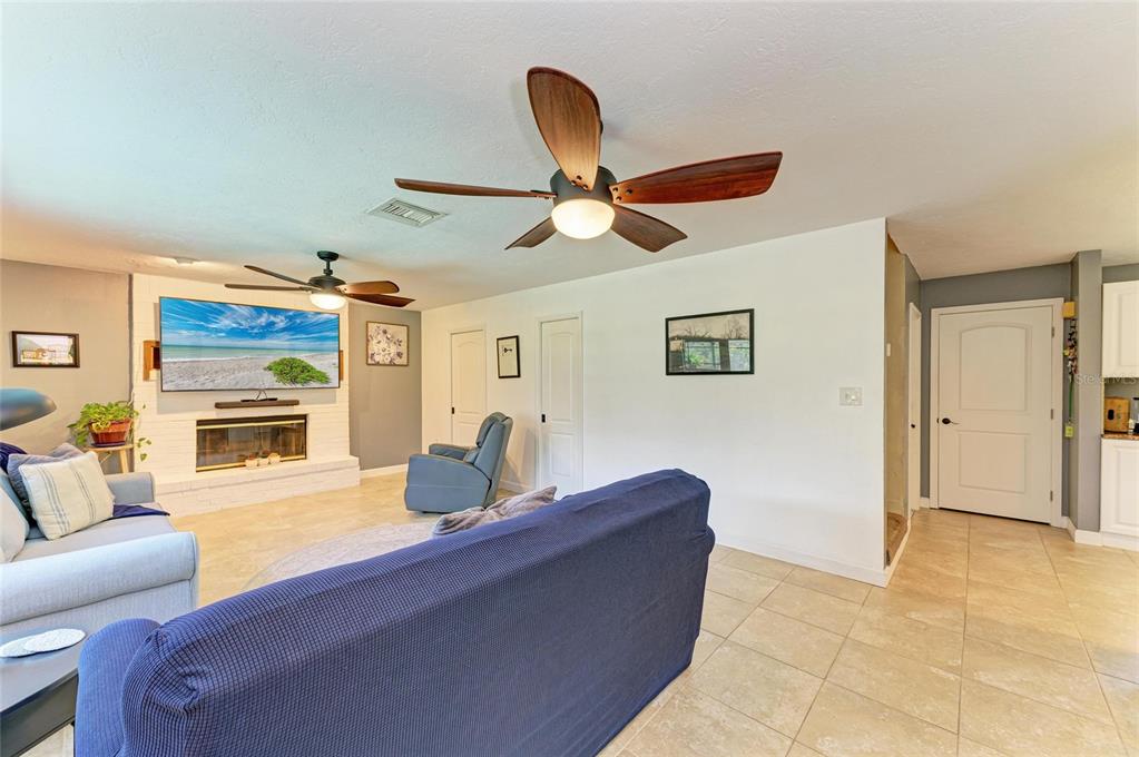 6114 Cypress Circle Bradenton, FL 34202 - Photo 12 of 67 a living room with furniture and a chandelier