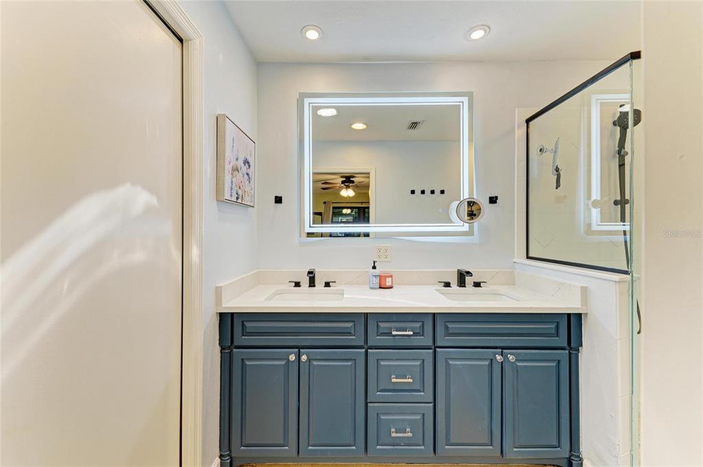 6114 Cypress Circle Bradenton, FL 34202 - Photo 19 of 67 a bathroom with a sink double vanity and a mirror