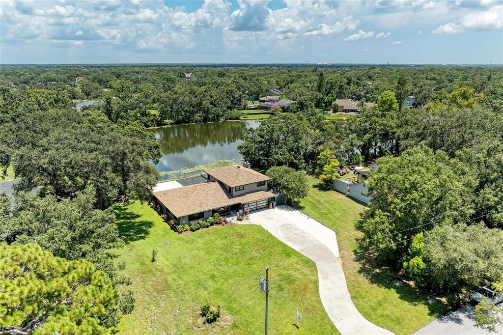 6114 Cypress Circle Bradenton, FL 34202 - Photo 36 of 67 a picture of a yard with a lake view