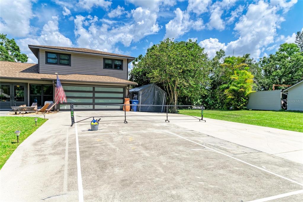 6114 Cypress Circle Bradenton, FL 34202 - Photo 44 of 67 a house with a yard and a garage
