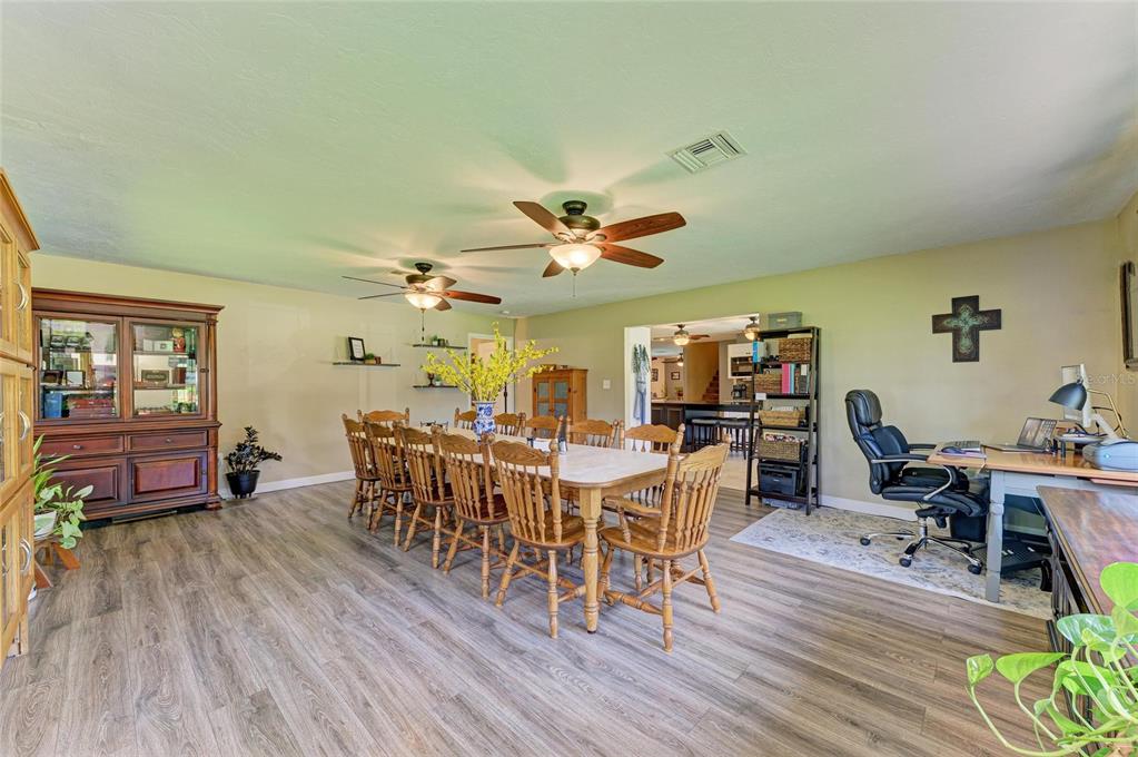 6114 Cypress Circle Bradenton, FL 34202 - Photo 48 of 67 a view of a dining room with furniture window and wooden floor
